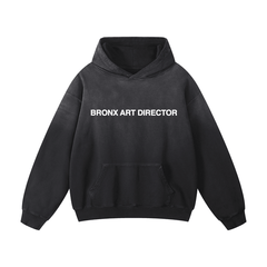 Black hoodie with 'BRONX ART DIRECTOR' text on a white background