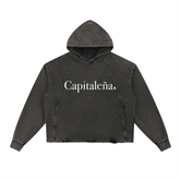 Dark cropped hoodie with 'Capitaleña' text, urban streetwear style for bold NYC-inspired fashion