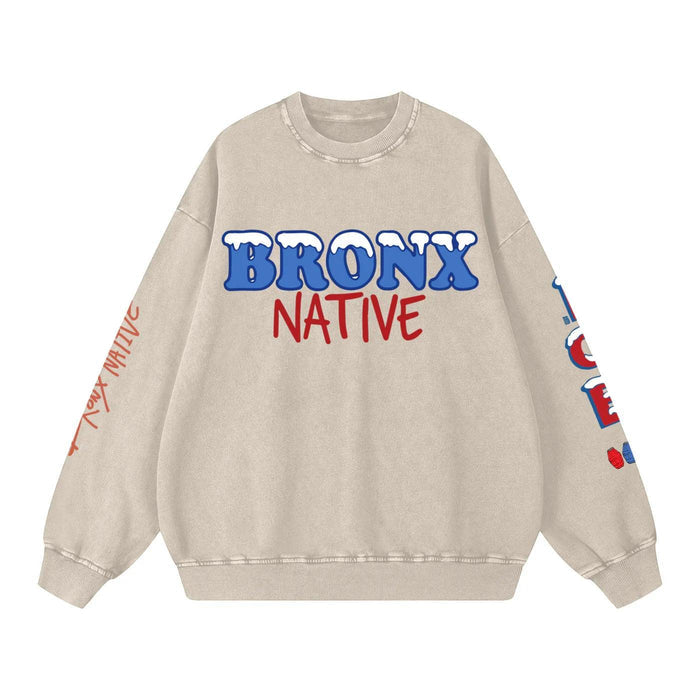Beige sweatshirt with 'Bronx Native' text in blue and red on a white background