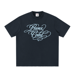 Black Bronx Coded streetwear tee with light blue script graphic, inspired by NYC culture