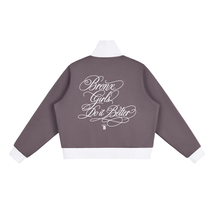 Gray varsity jacket with 'Bronx Girls Do It Better' in white script, NYC streetwear style