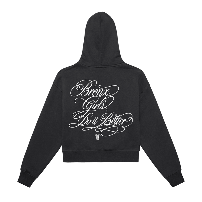 Black hoodie with 'Bronx Girls Do It Better' in white script, NYC-inspired streetwear design.