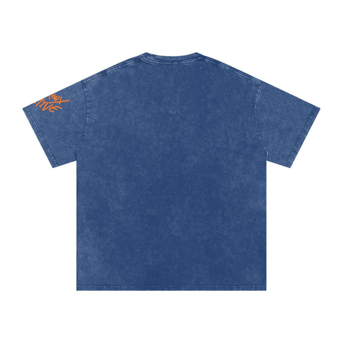 Back view of blue acid-wash short sleeve t-shirt with orange graphic text on left sleeve