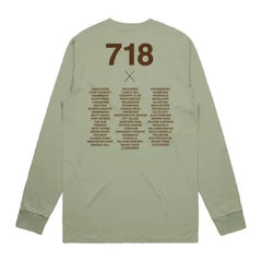Green long-sleeve shirt with text on the back on a white background