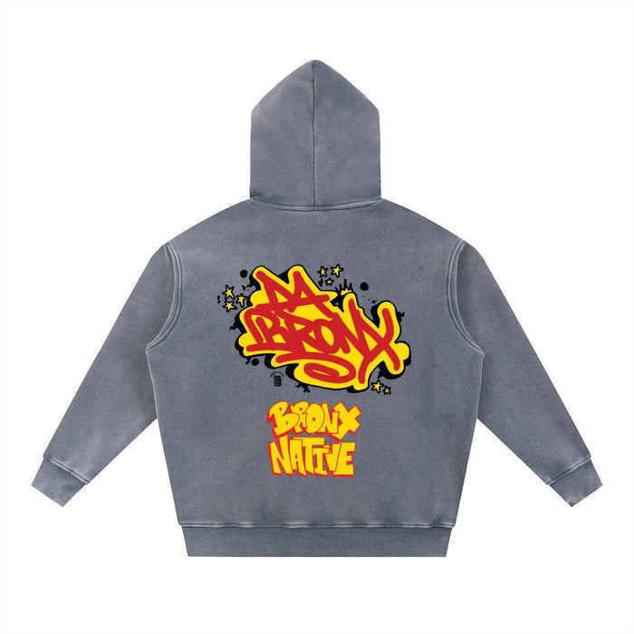 Gray hoodie with bold Bronx Native graffiti design, vibrant yellow and red streetwear style