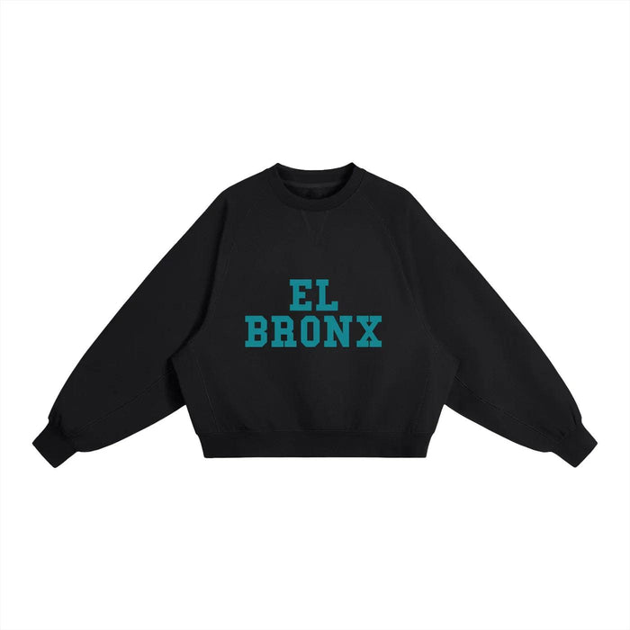Black cropped sweatshirt with teal 'EL BRONX' graphic, bold streetwear inspired by NYC culture