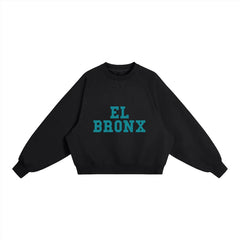 Black cropped sweatshirt with teal 'EL BRONX' graphic, bold streetwear inspired by NYC culture