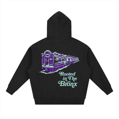Black hoodie with purple and green 'Rooted in The Bronx' subway graphic design