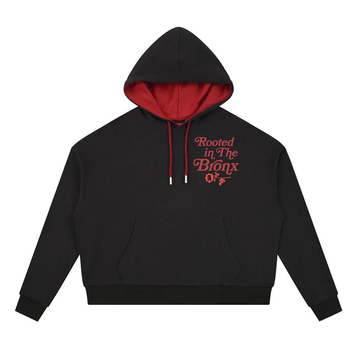 Black hoodie with red 'Rooted in The Bronx' text and rose design, bold streetwear style