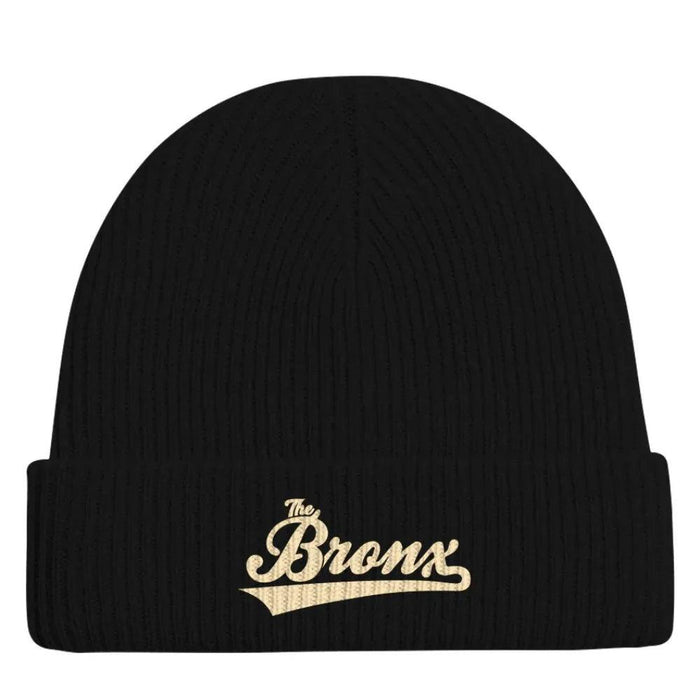 Black ribbed beanie with gold 'The Bronx' script embroidery, NYC streetwear style