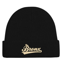 Black ribbed beanie with gold 'The Bronx' script embroidery, NYC streetwear style